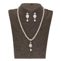 Close-up of a white fresh water pearl pendant set with CZ accents and gold plating