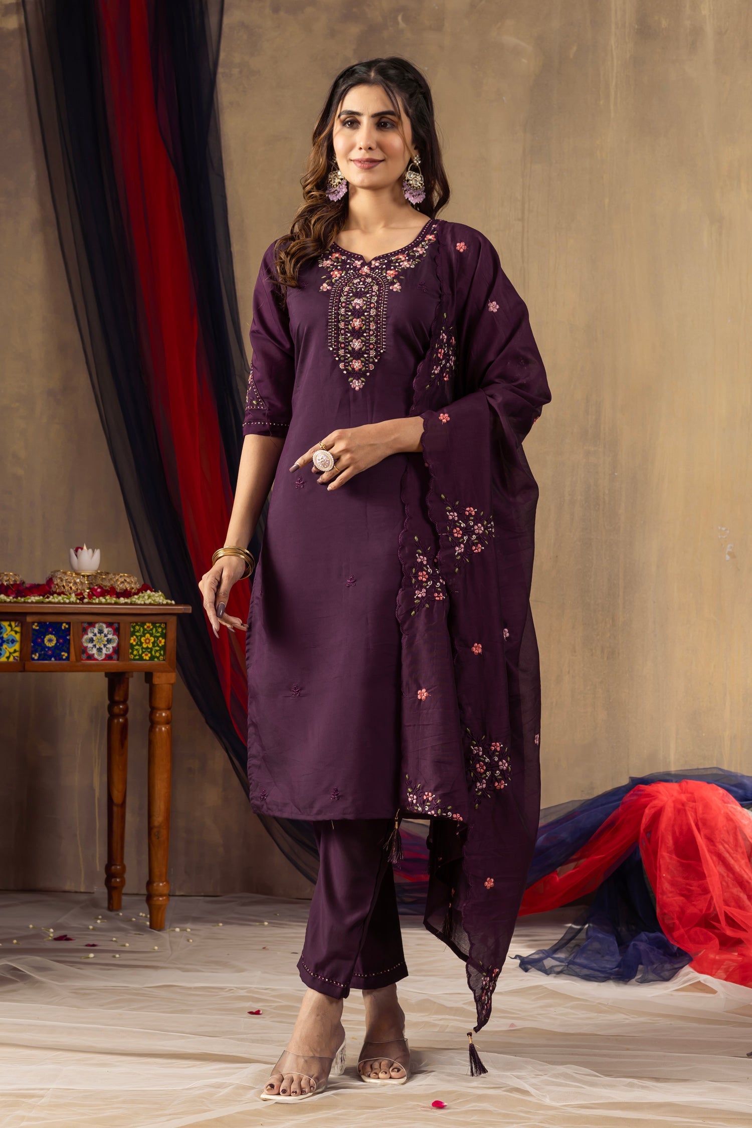 Close up of a Wine Roman silk kurta featuring intricate sequin embroidery and detailed hand-work.