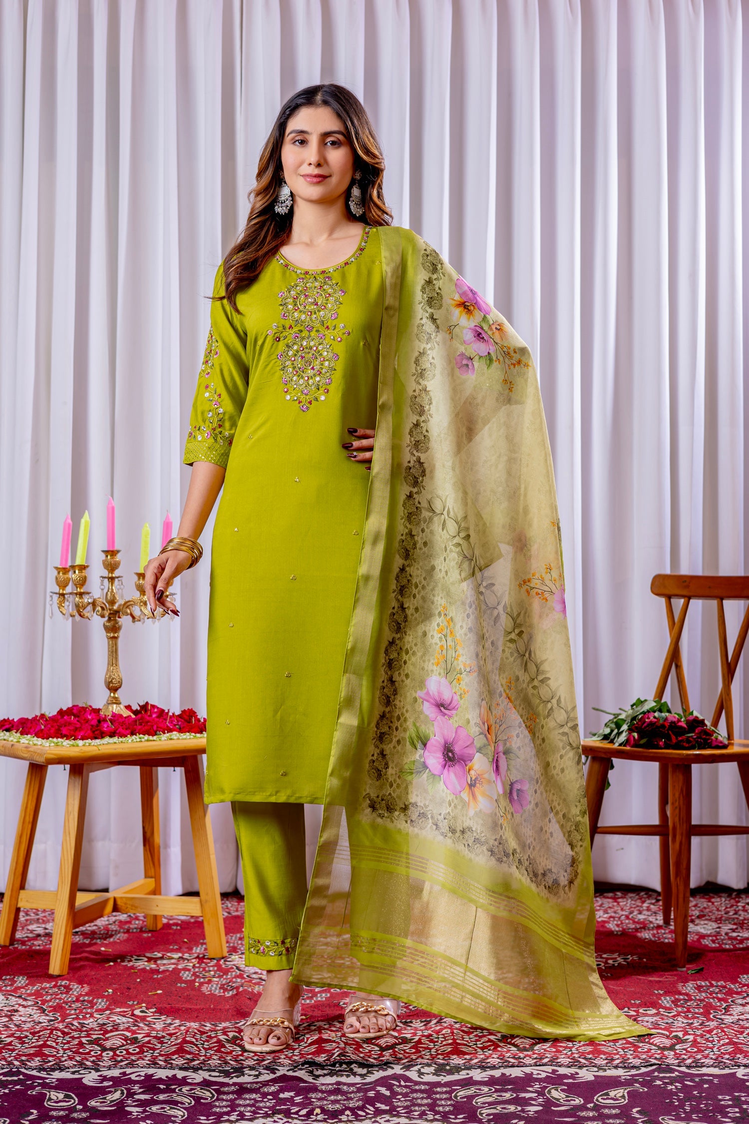 A vibrant parrot green viscose silk kurta set with floral multi-color embroidery, straight pants, and matching dupatta.