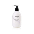Bottle of Jurlique Lavender Calming Body Lotion, 10 OZ, white pump bottle with botanical imagery.