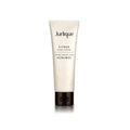 Jurlique Citrus Hand Cream 4.3 oz tube displayed with fresh citrus elements