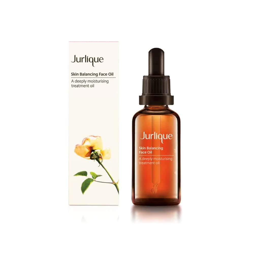 Bottle of Jurlique Skin Balancing Face Oil 1.6oz with botanical ingredient highlights