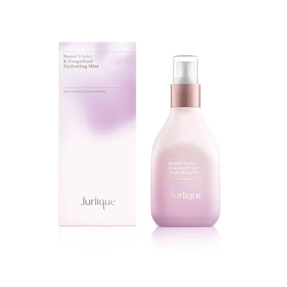 Jurlique Sweet Violet & Grapefruit Hydrating Mist bottle in pink and lavender hues