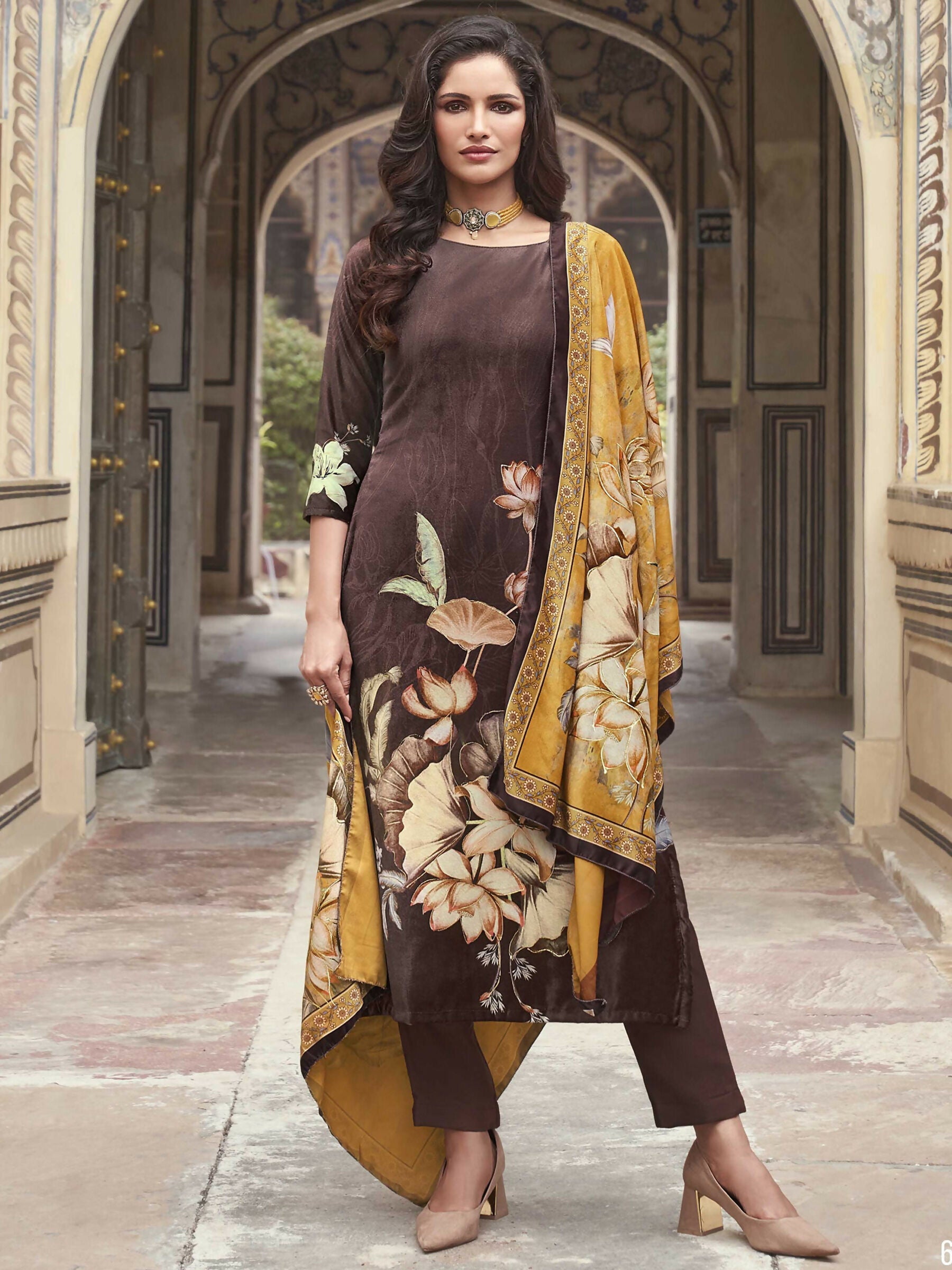 Front view of a brown velvet straight kurta with digital floral print, paired with palazzo pants and matching dupatta