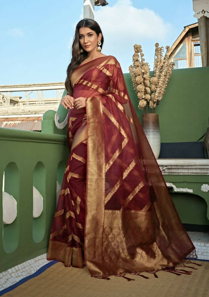 Maroon Organza Silk saree with intricate weaving patterns and decorative tassels