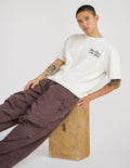 Jesus Loves New York graphic tee in off-white, cream, and blue heavyweight cotton