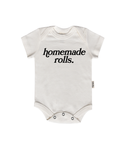 Close up of the Homemade Rolls baby onesie in Natural cotton fabric.