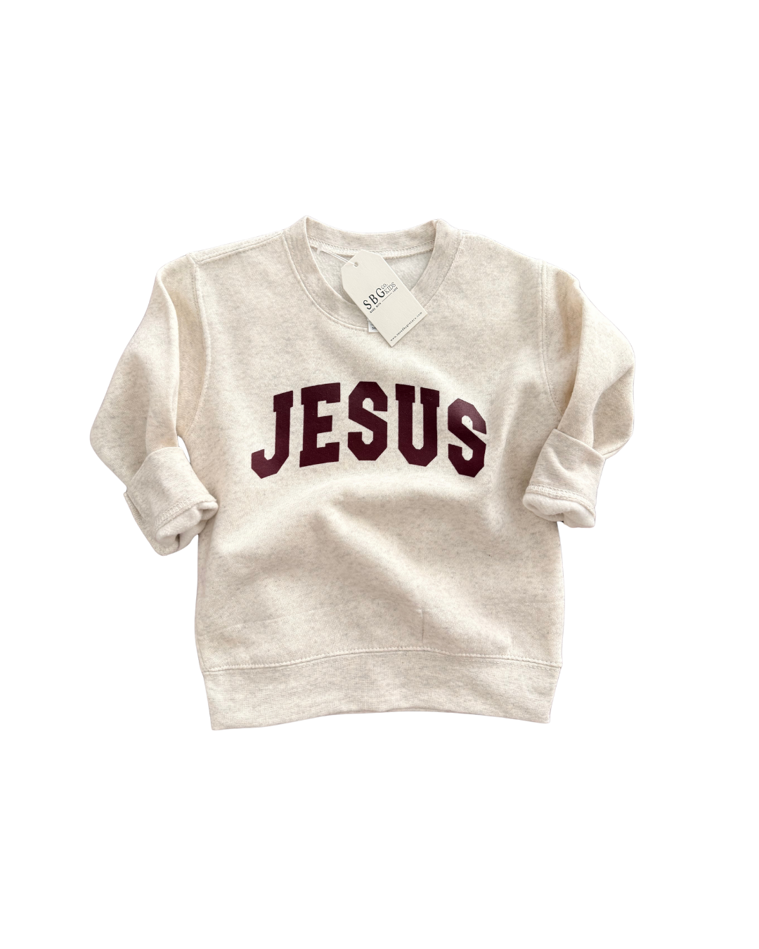 Child wearing a Jesus Varsity Crew Sweatshirt in Natural, showcasing a classic sporty font design.