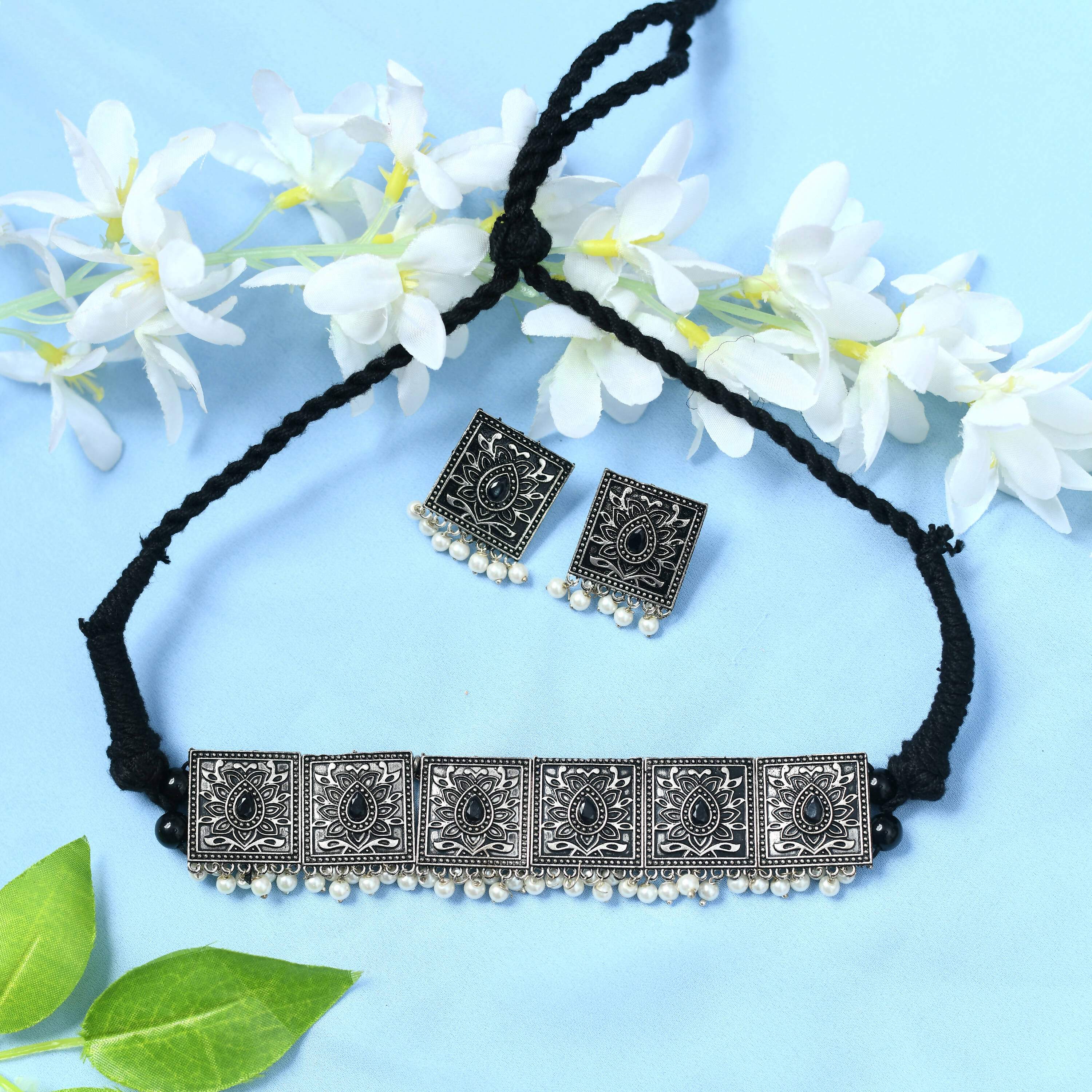 Silver-plated brass statement choker with black beads, Kundan stones, and pearl accents