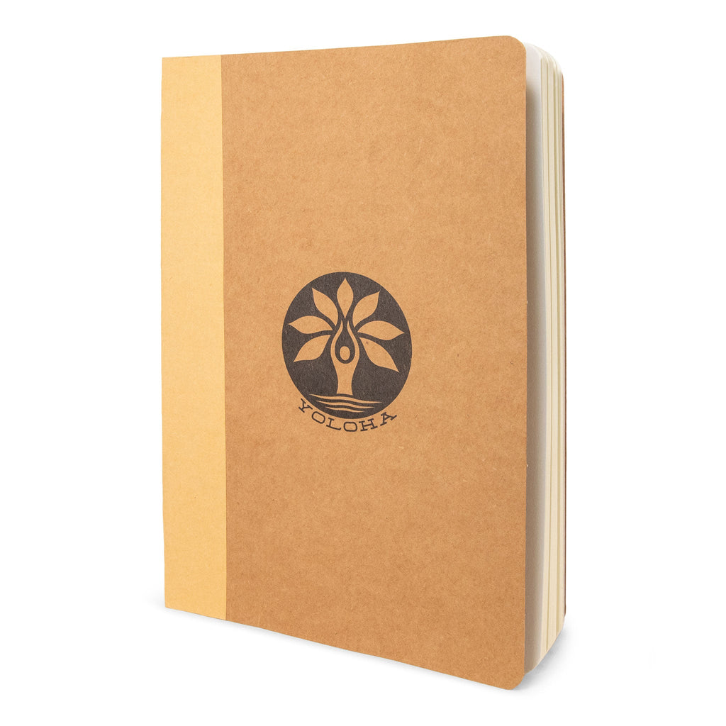 A stack of A5 kraft paper journal refills with minimalist design in tan and brown