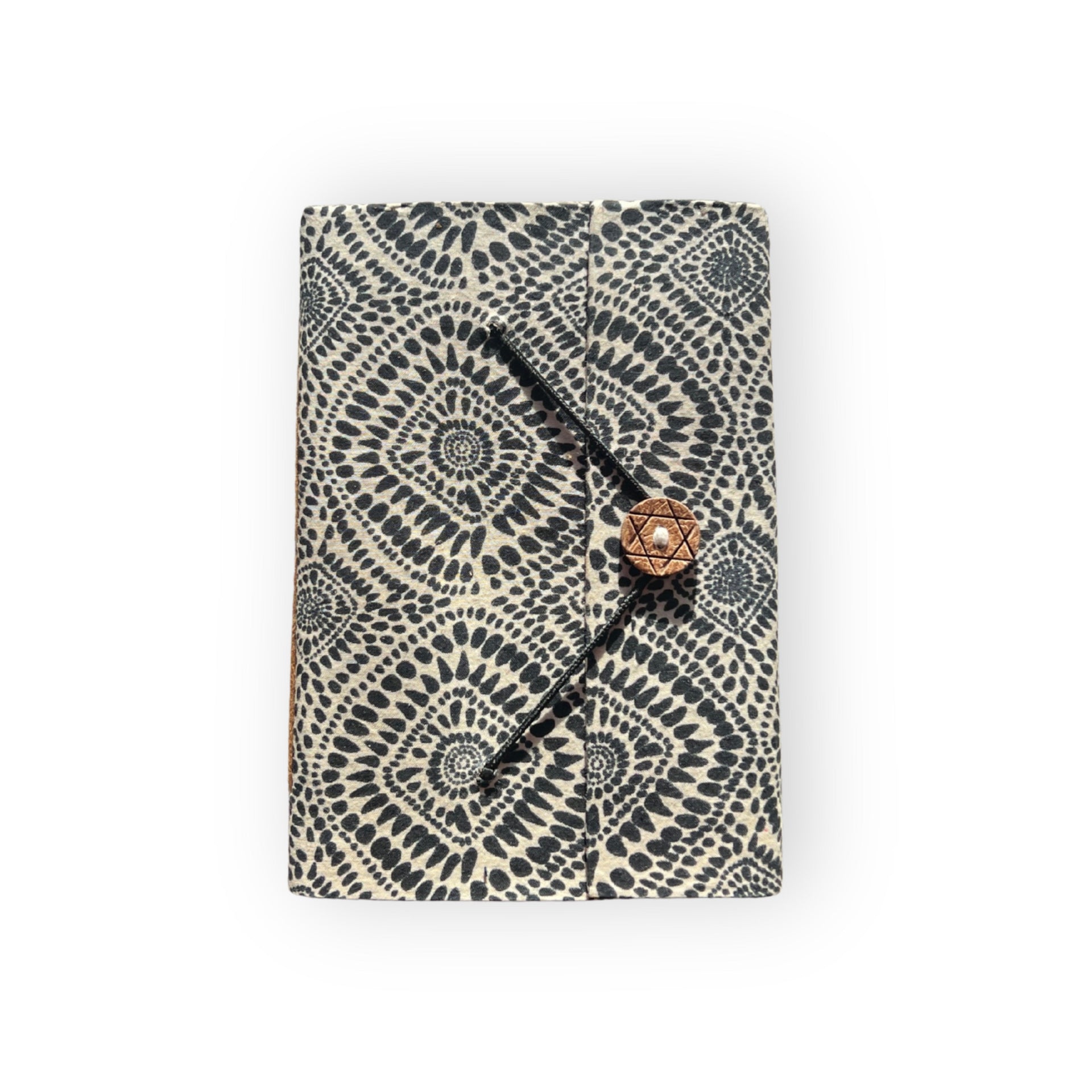 Handcrafted A5 recycled paper journal featuring a black tribal print pattern on the cover.