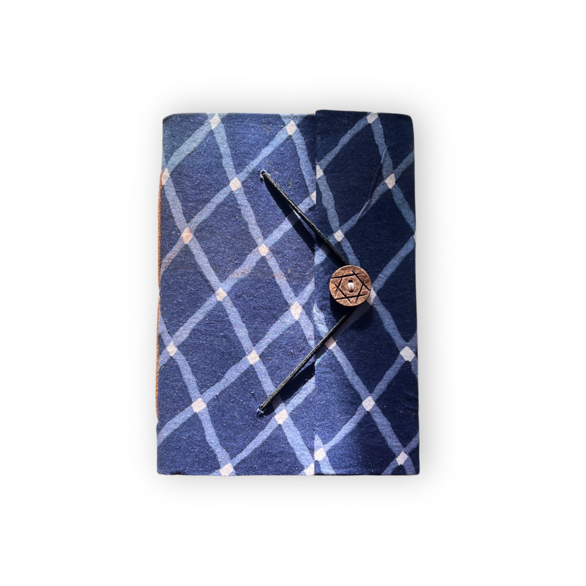 A5 handcrafted journal with a navy blue stripe pattern on a minimalist desk.