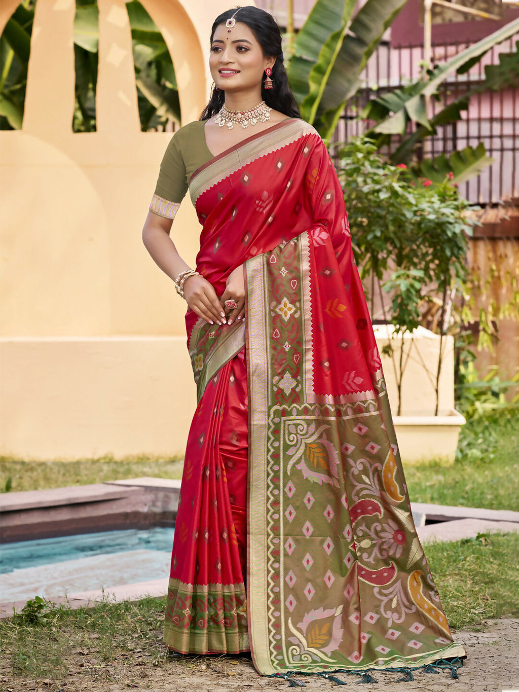 A beautiful Red Pochampally silk saree with matching blouse fabric displayed elegantly.