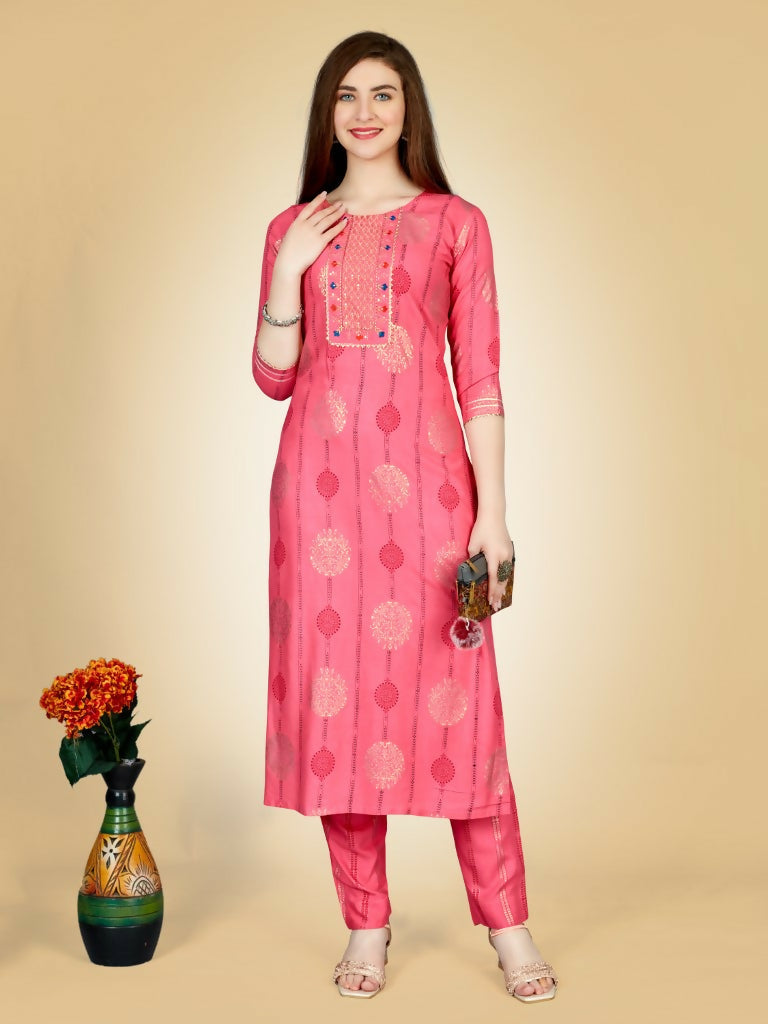 Women wearing a pink embroidered straight kurta pant set in viscose rayon fabric.