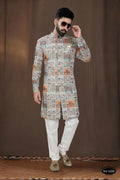 Boys blue georgette kurta with intricate thread and sequence embroidery paired with a pyjama.