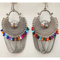 Silver oxidized half moon Chandbali earrings with multi-color pearl accents and dangling chains.