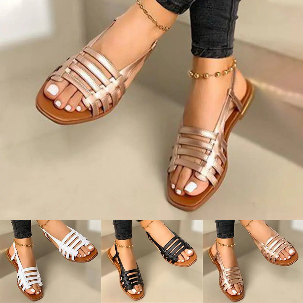A pair of women's hollow flat summer sandals available in black, white, and metallic tones shown on feet.