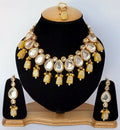 Yellow Kundan stone necklace set with gold-plated finish