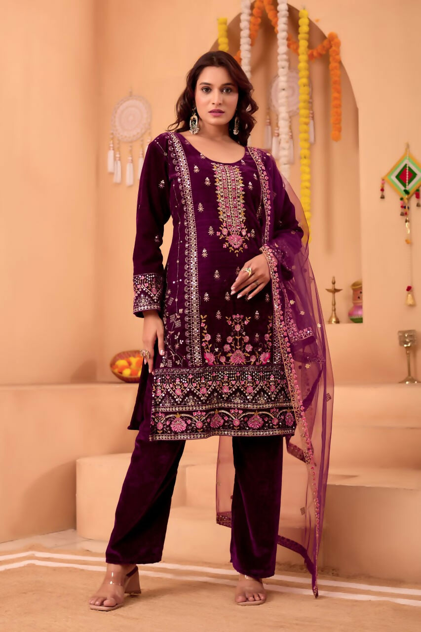 Front view of a purple velvet kurta set featuring detailed embroidery and sequence work