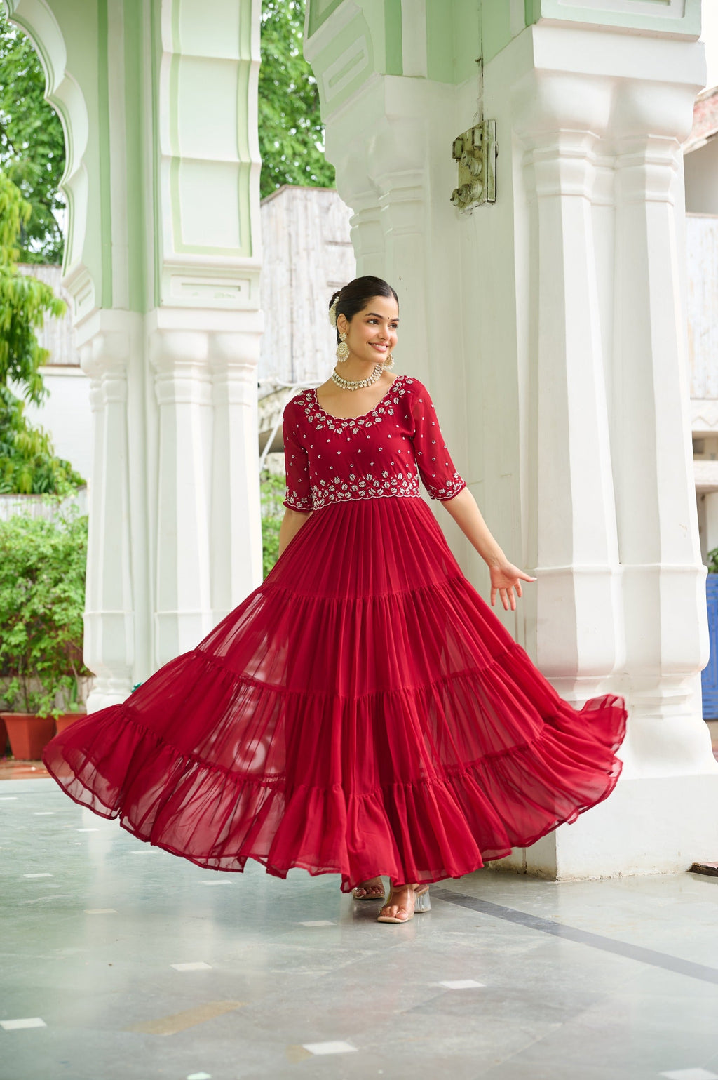 Maroon faux blooming georgette gown featuring intricate beads embroidery and a wide 12-meter flair