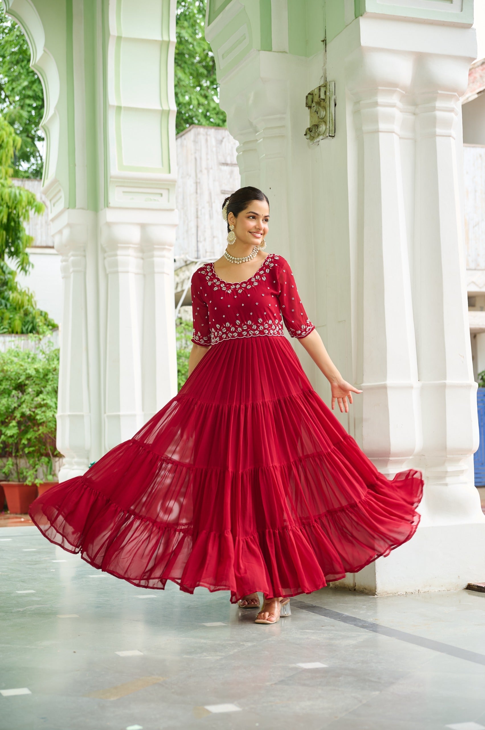 Maroon faux blooming georgette gown featuring intricate beads embroidery and a wide 12-meter flair