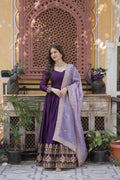 A beautiful floor-length violet georgette gown with gold embroidery, sequins, and a lavender dupatta.
