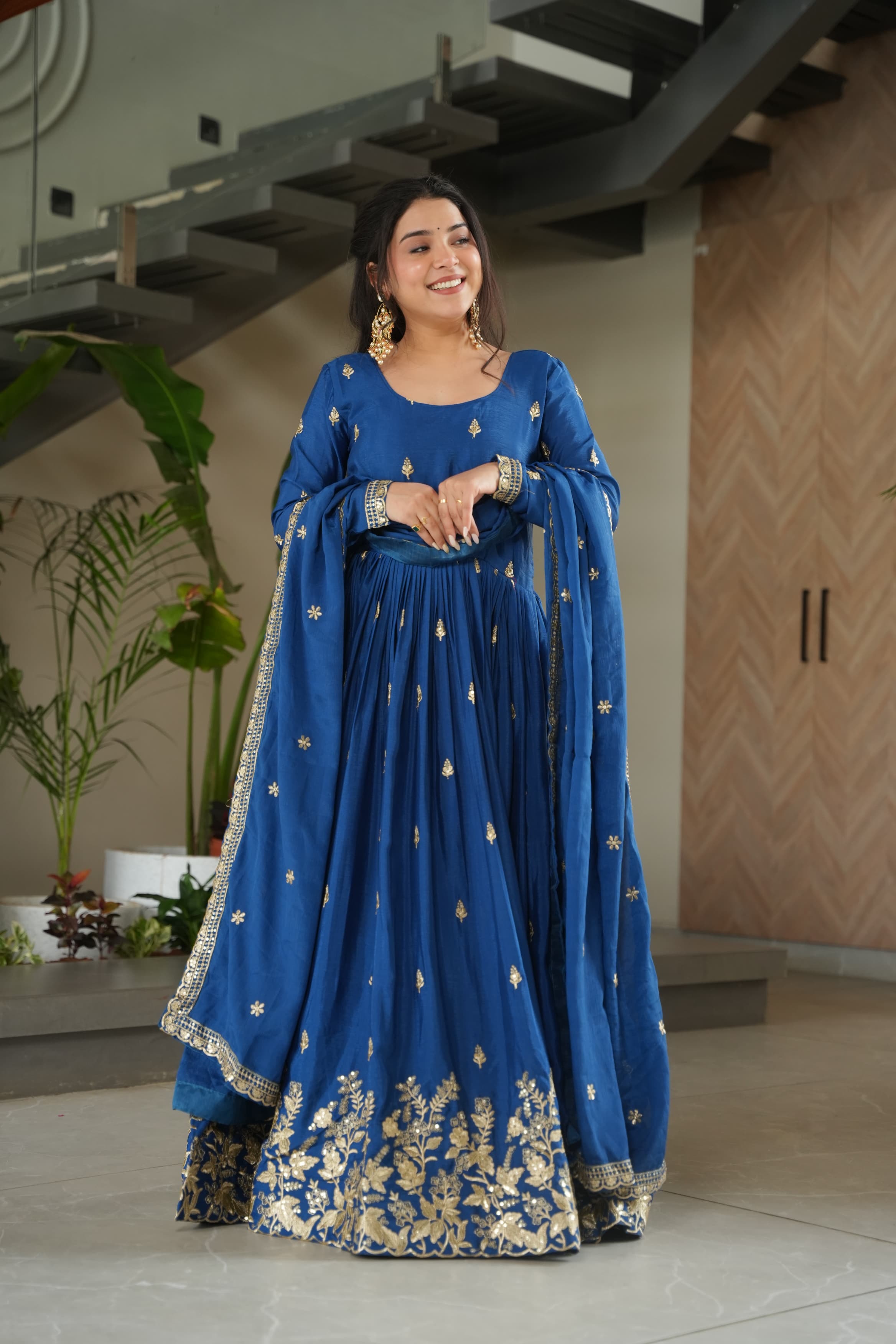 Blue Chinon silk gown with gold Zari embroidery and matching dupatta