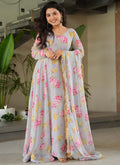 Woman wearing a light grey faux georgette gown with digital prints and a matching dupatta
