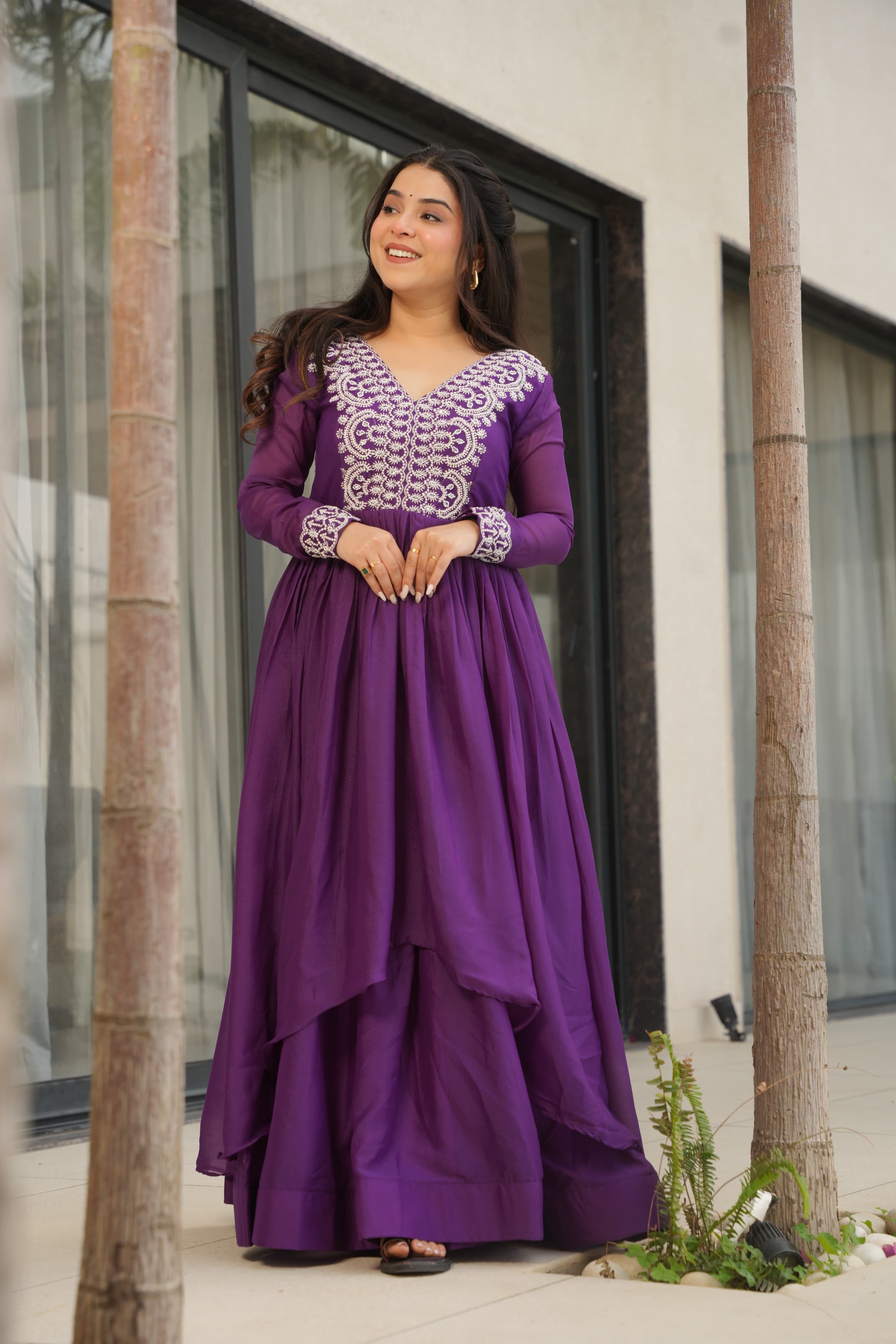 A beautiful purple georgette designer gown with detailed bead and sequin embroidery.