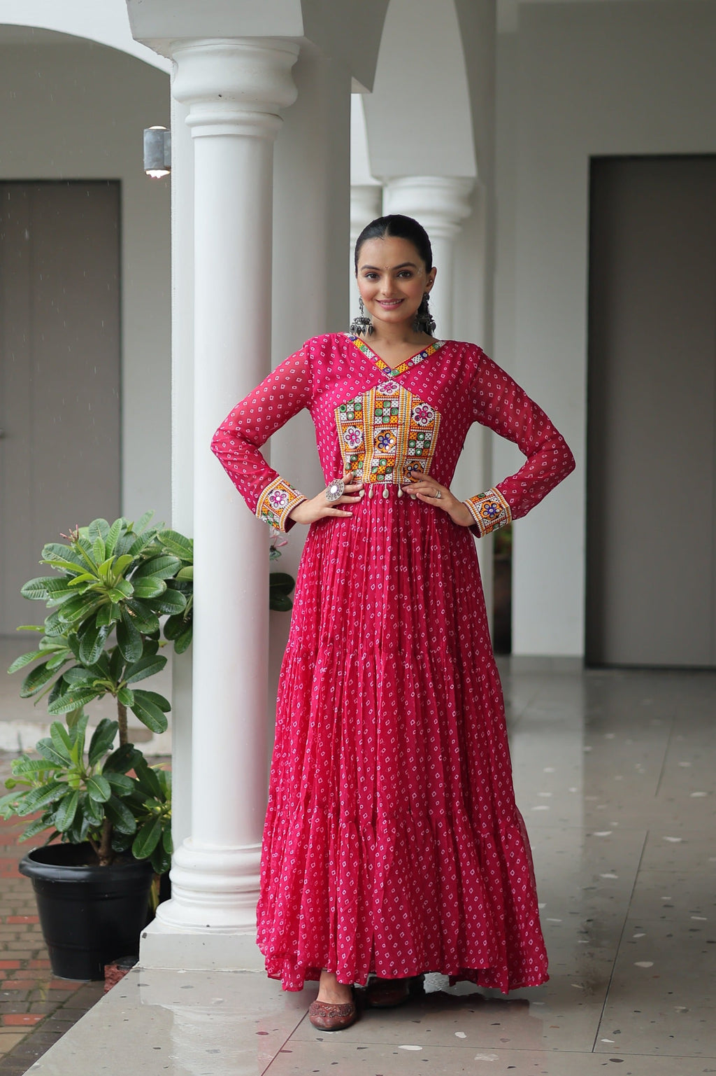 Pink Georgette Bandhani printed gown with traditional Kutchi patchwork detail