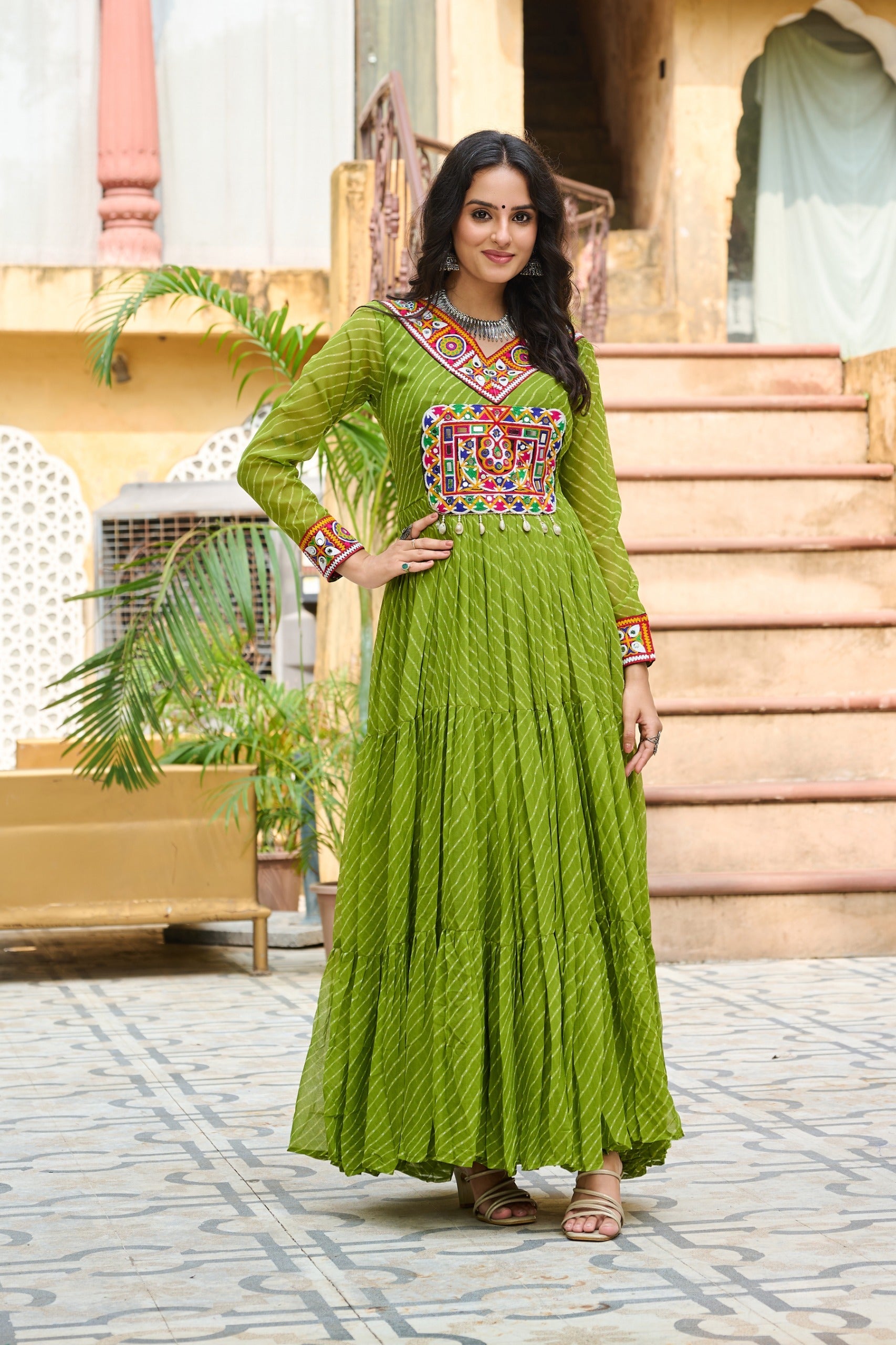 Parrot green faux georgette gown with Leheriya print and colorful Kutchi patchwork details