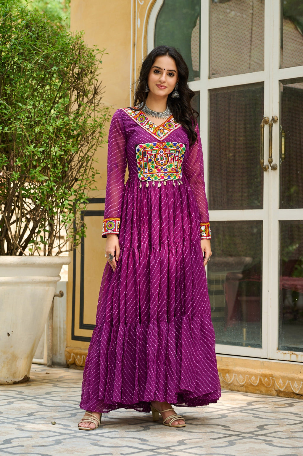 Wine colored Faux Georgette gown with traditional Leheriya print and Kutchi patchwork design.