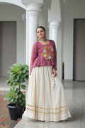 Wine colored Bandhani print Navratri lehenga with Kutchi Gamthi patchwork and Gota-Patti lace