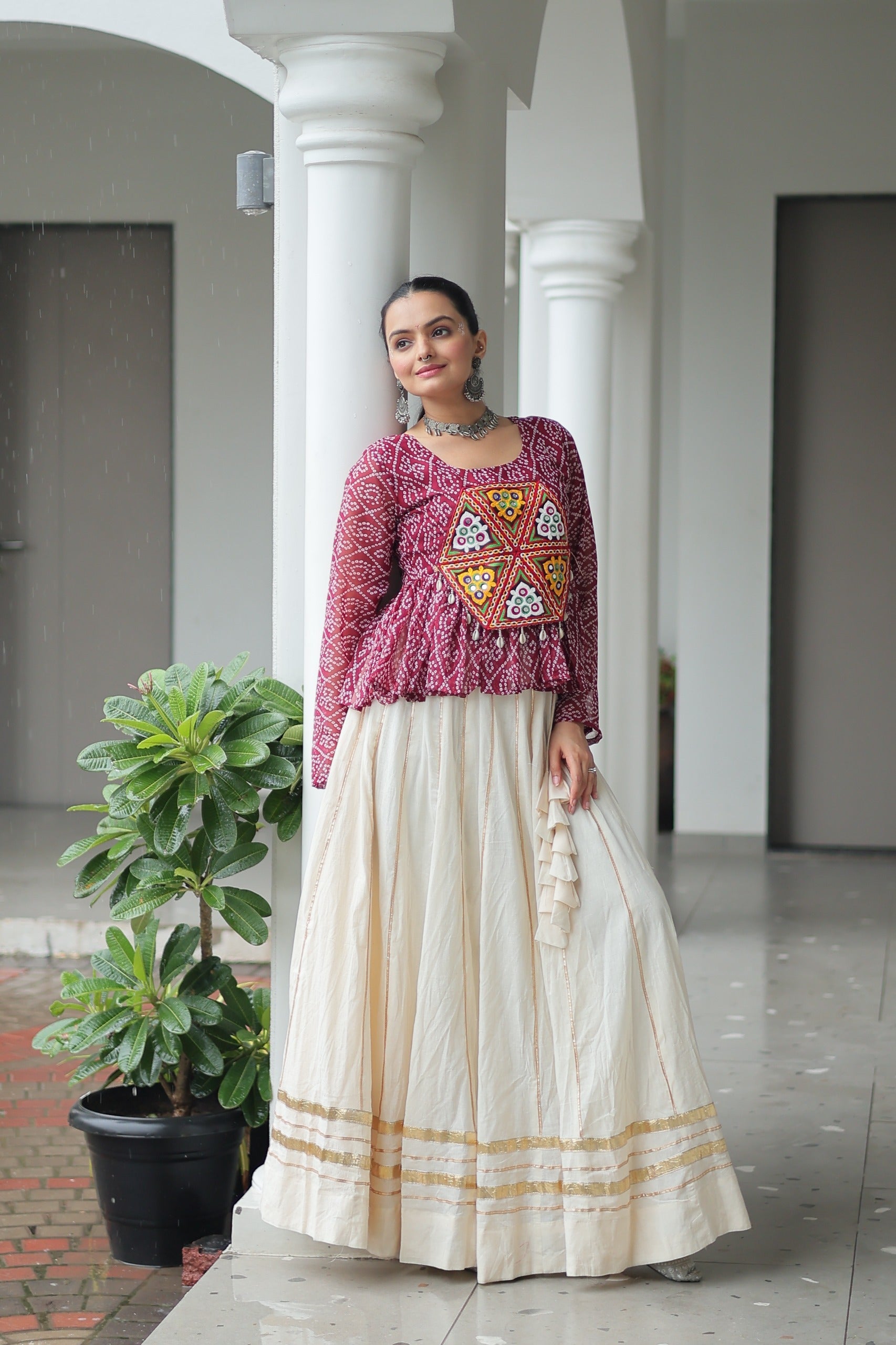 Wine colored Bandhani print Navratri lehenga with Kutchi Gamthi patchwork and Gota-Patti lace