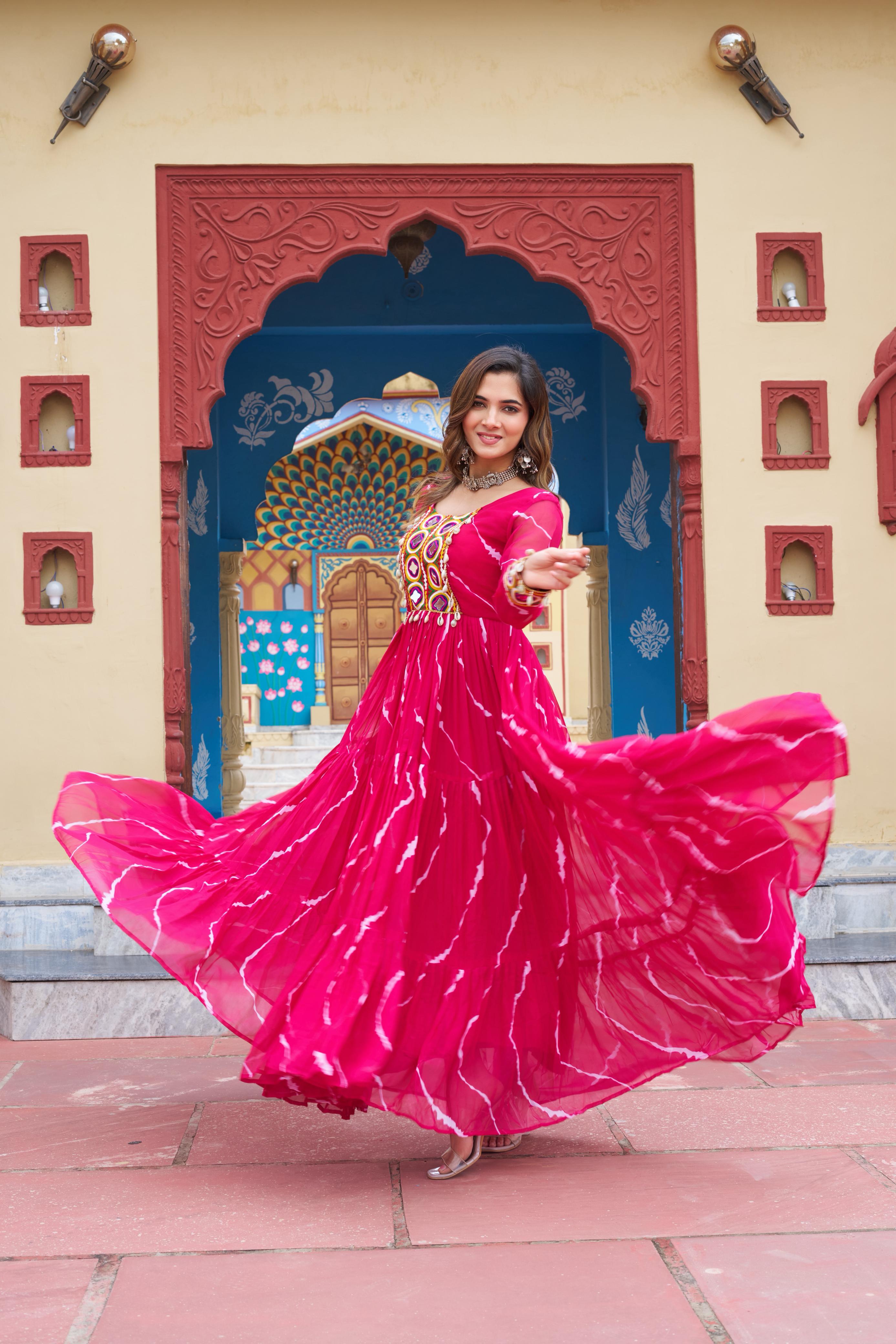 Pink georgette gown with traditional Laheriya print and festive Kutchi patch embroidery