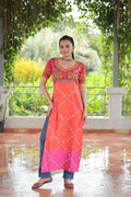 Orange rayon kurti with Kutchi Gamthi festive print