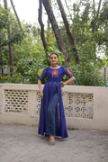A blue Faux Georgette Bandhani print kurti featuring traditional Kutchi patch work and a 52-inch length.