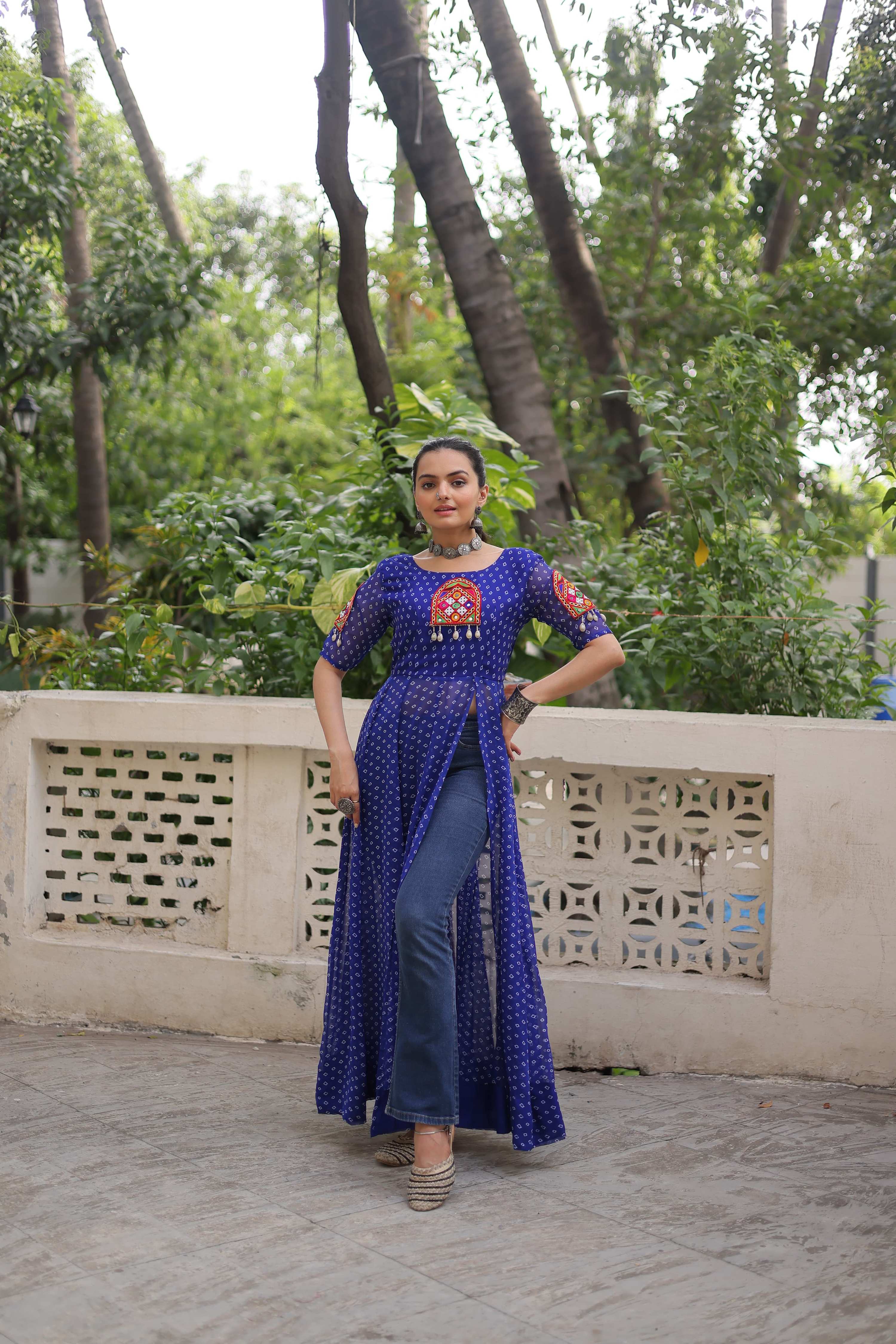 A blue Faux Georgette Bandhani print kurti featuring traditional Kutchi patch work and a 52-inch length.