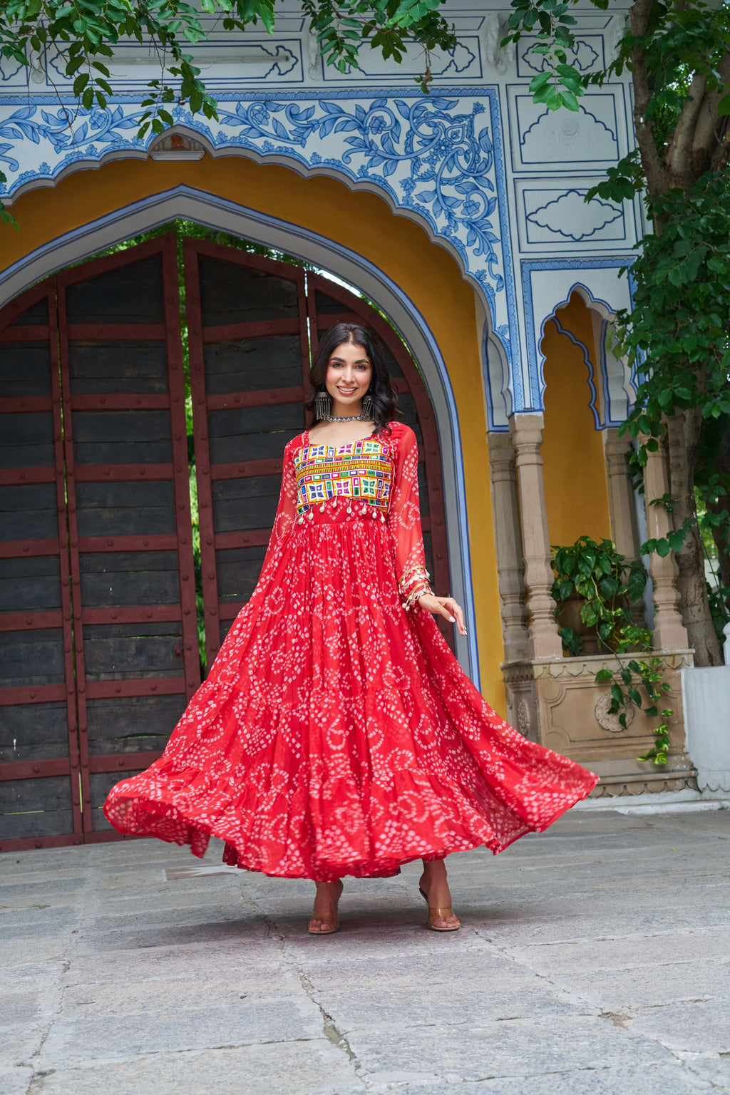 A beautiful red georgette gown featuring Bandhani print and Kutchi patchwork, ideal for festive ethnic wear.