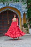 A beautiful red georgette gown featuring Bandhani print and Kutchi patchwork, ideal for festive ethnic wear.