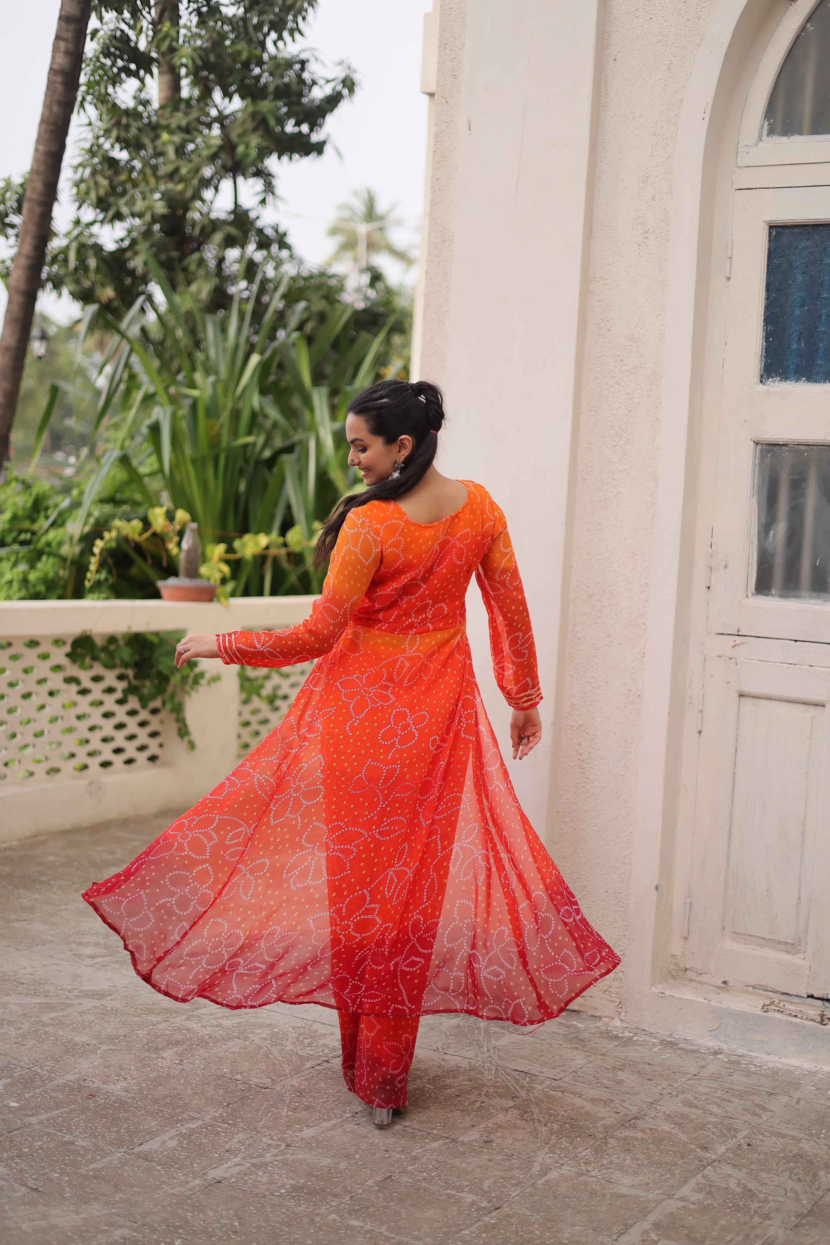Orange Georgette Bandhani Print Suit with Gamthi Patchwork