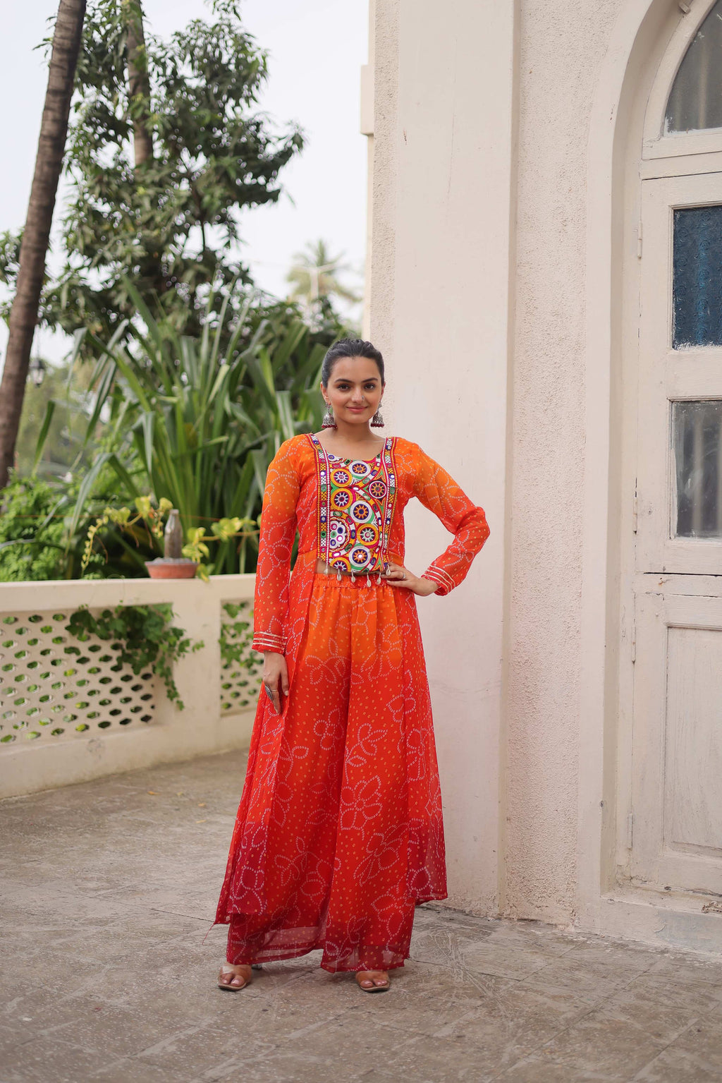 Orange Georgette Bandhani print suit with traditional Kutchi Gamthi patchwork for Navratri