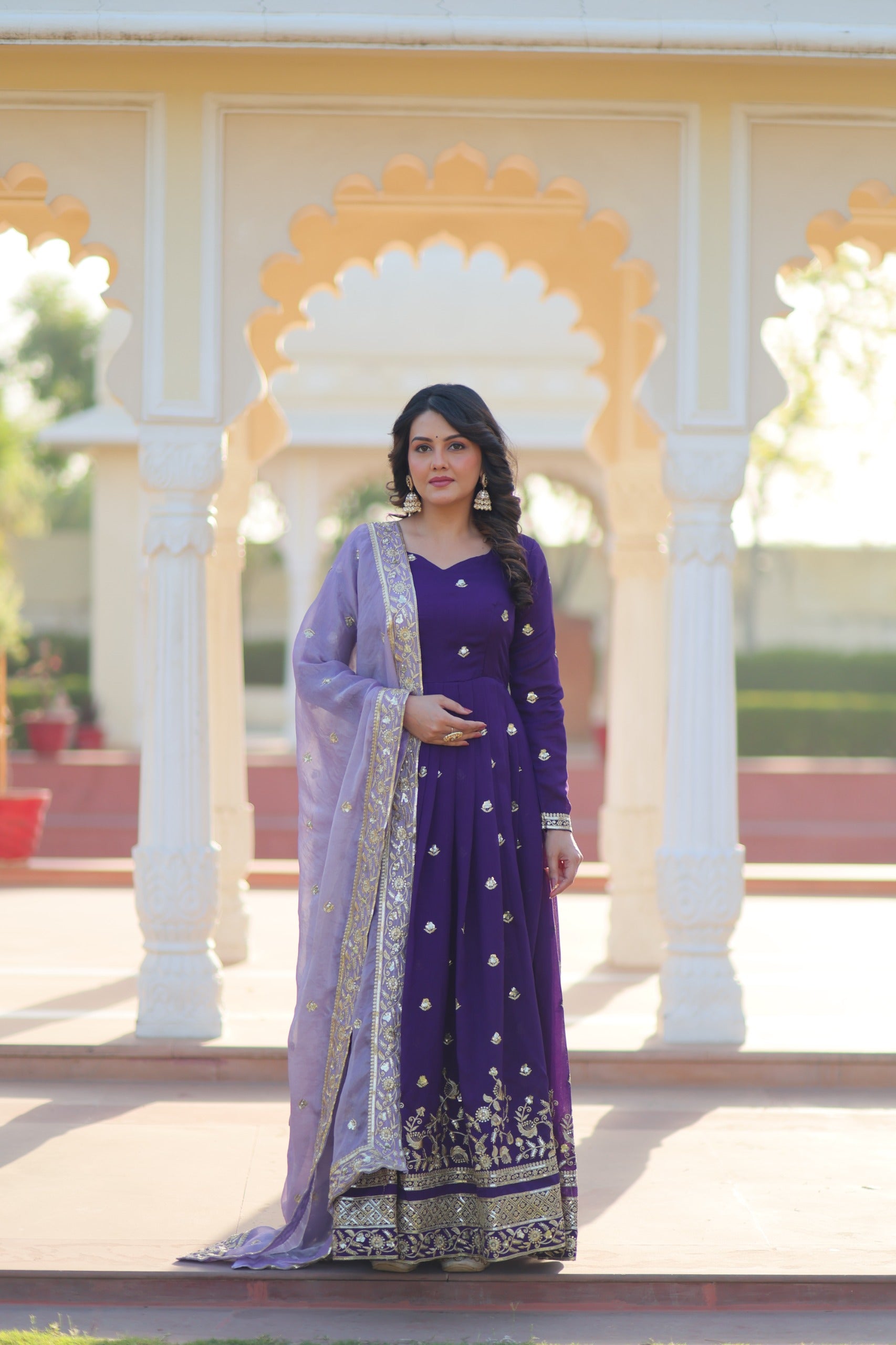Violet georgette gown featuring detailed zari embroidery and sequins work