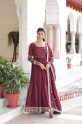 Brown Vichitra silk gown with heavy sequin work and wide flare, paired with a matching dupatta.