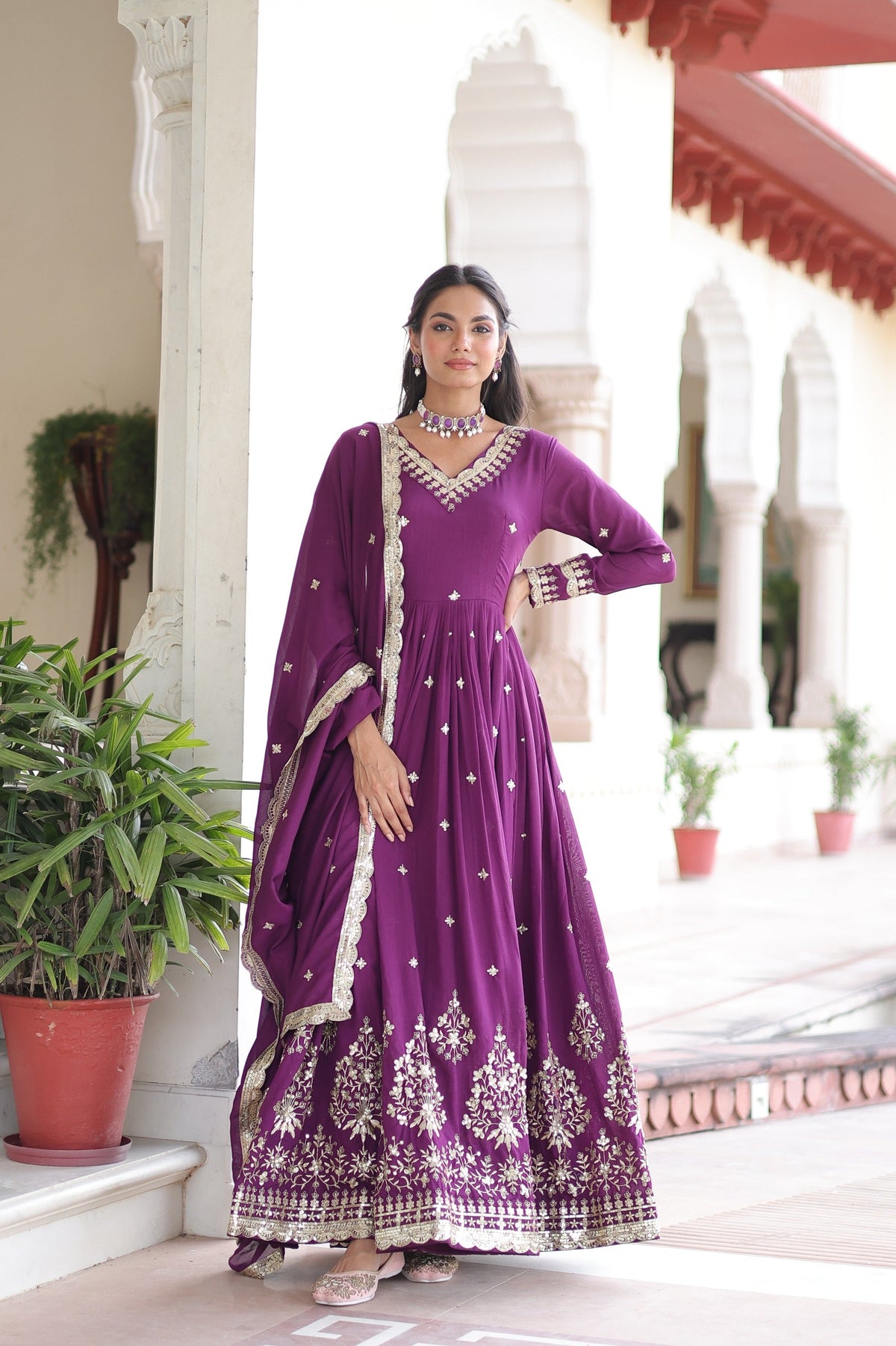 Wine-colored Vichitra silk gown with rich sequin embroidery and matching dupatta