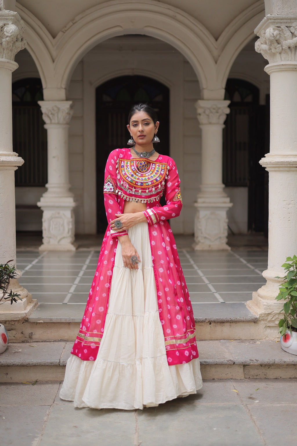 Pink Georgette Bandhani print Navratri lehenga with Kutchi patchwork and Dori latkan detail