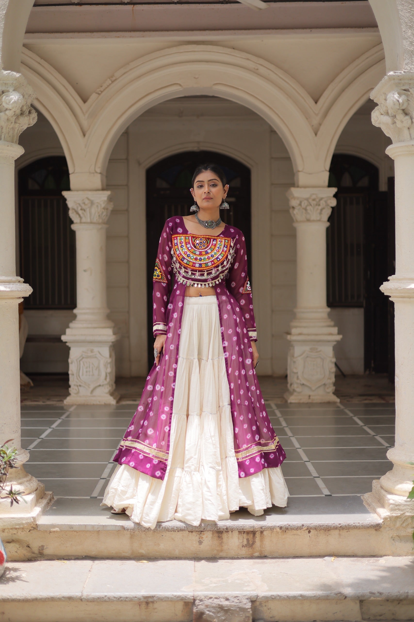 Wine Georgette Bandhani print lehenga with traditional Kutchi patchwork and frill stitching detail