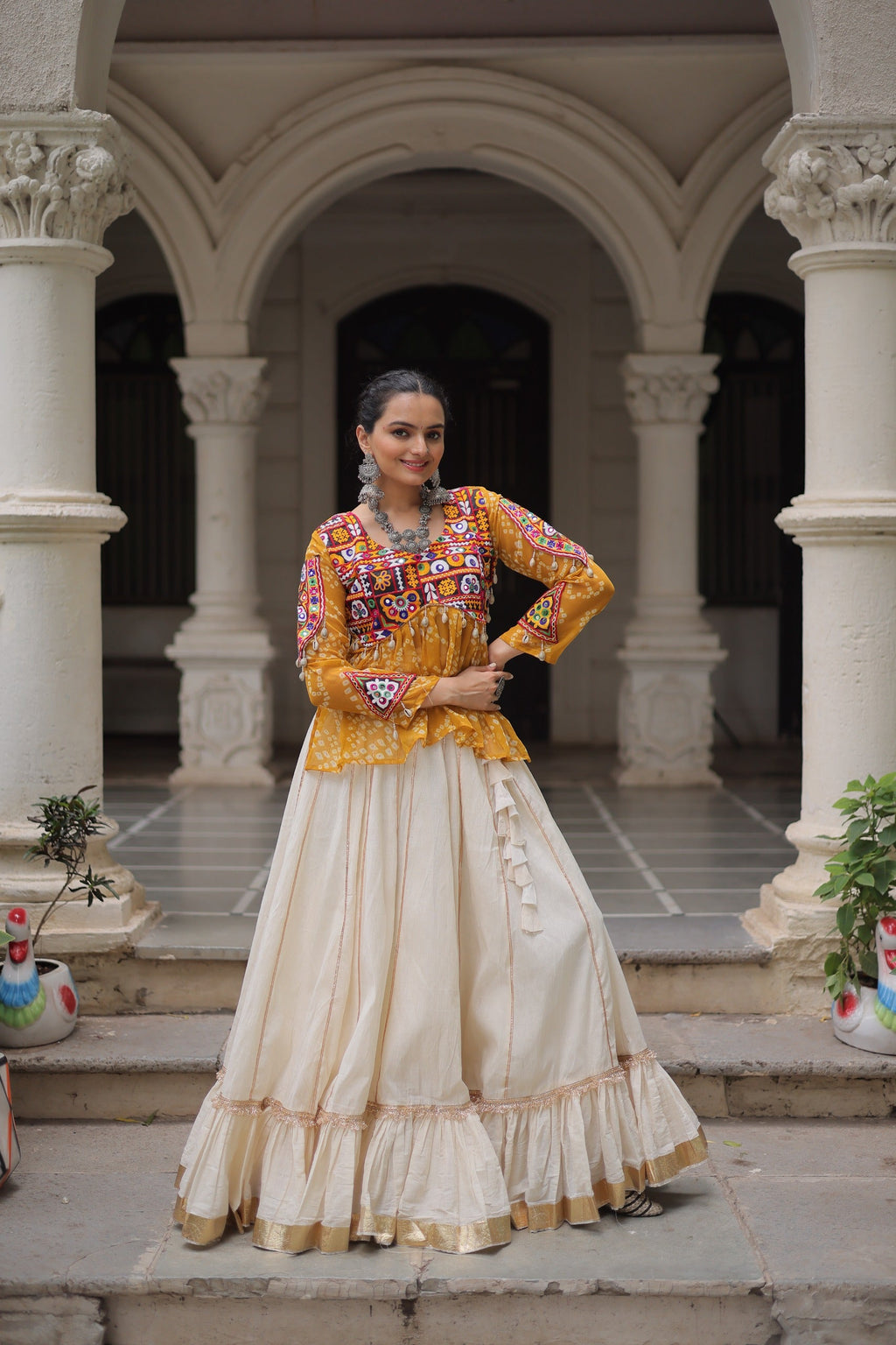 Bright yellow georgette lehenga with Bandhani pattern and Gota-Patti lace detailing