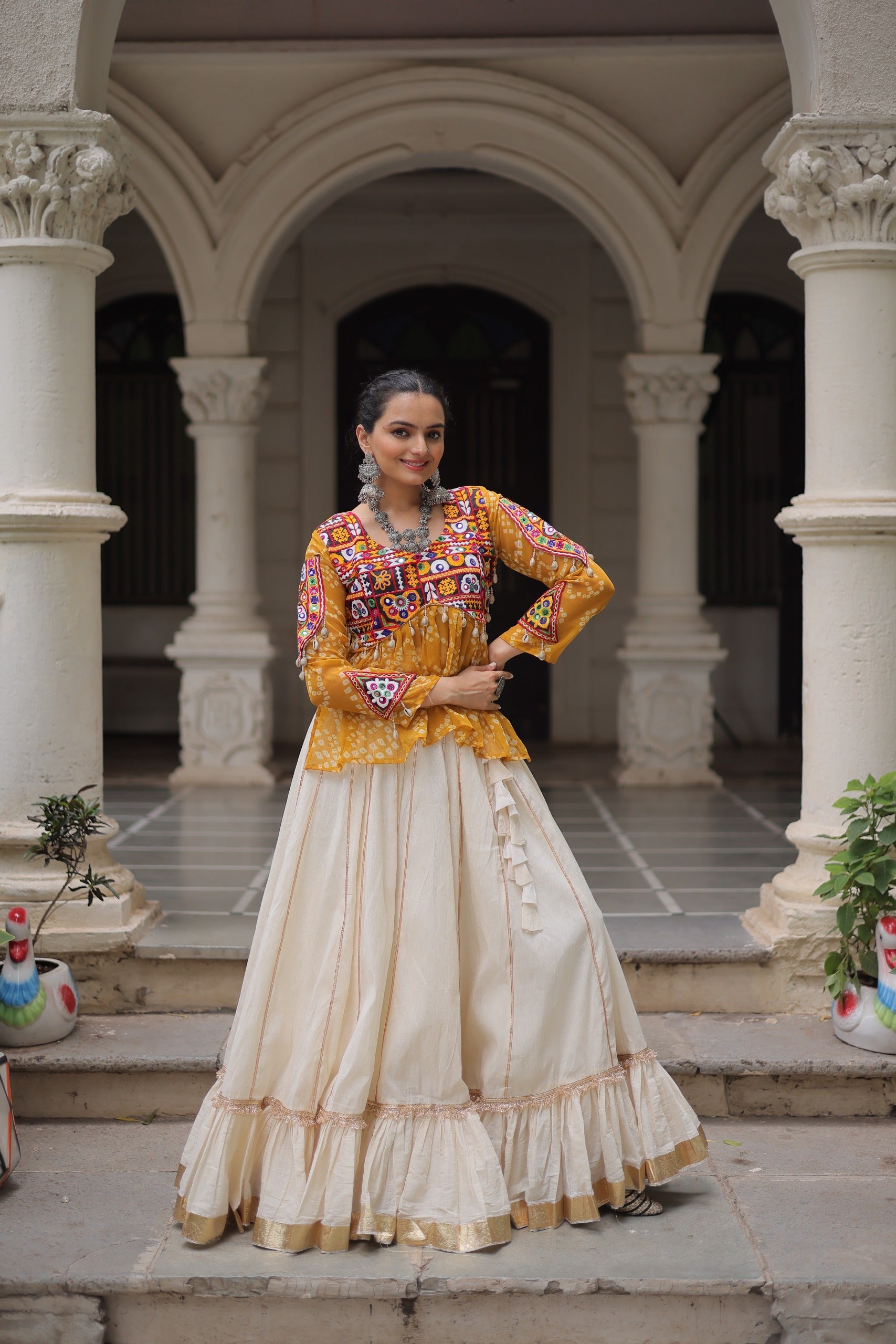 Bright yellow georgette lehenga with Bandhani pattern and Gota-Patti lace detailing