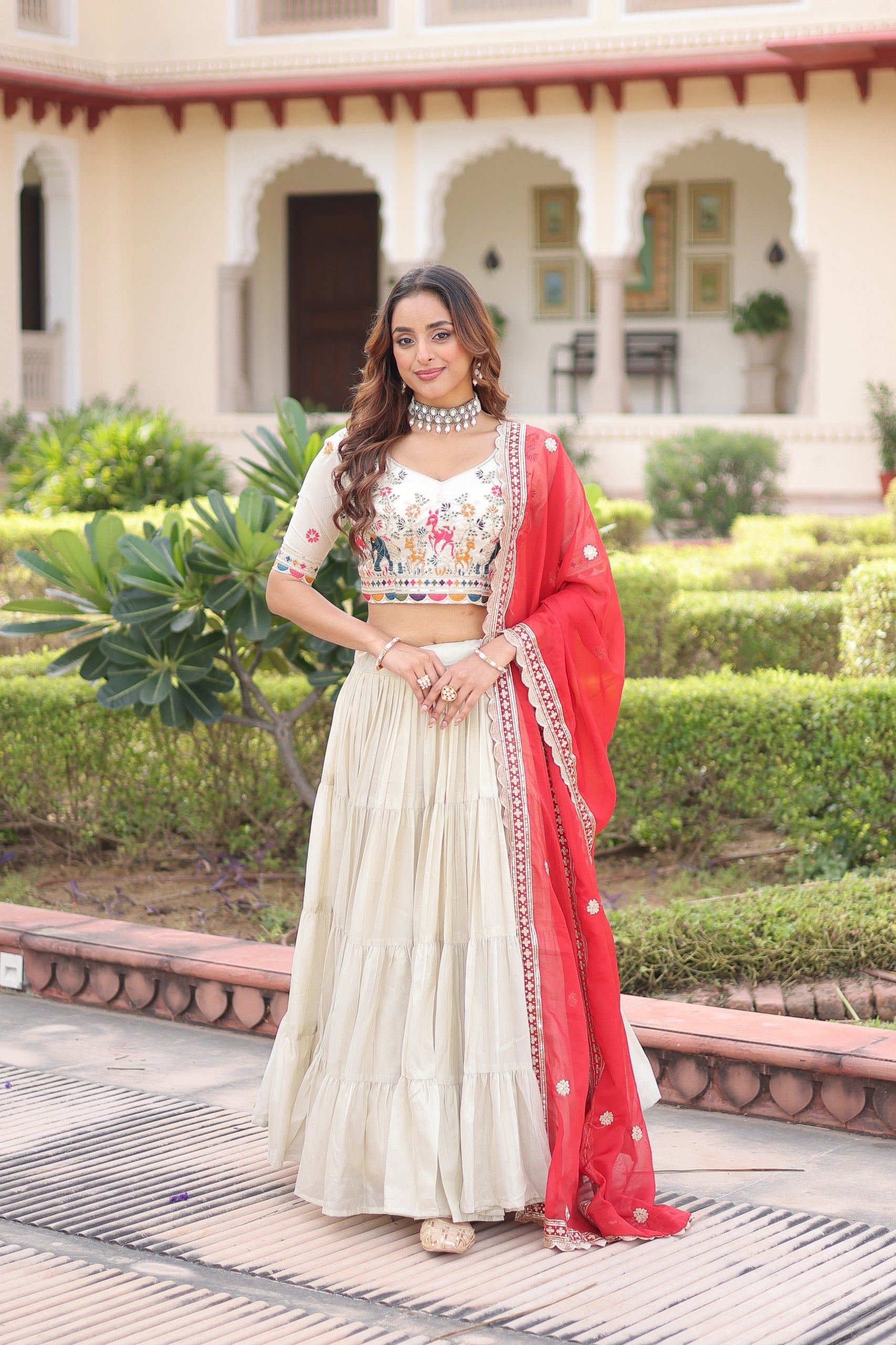 Off White Cosmos Silk Lehenga Choli with multi-thread embroidery and frill stitching